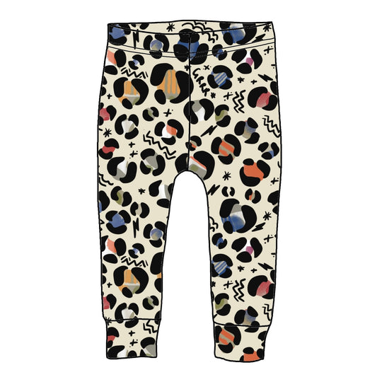 Cream coloured leggings with muted toned leopard print design. There are abstract shapes in the background.